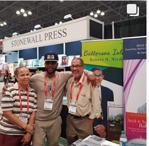 Stonewall Press author with booth in background